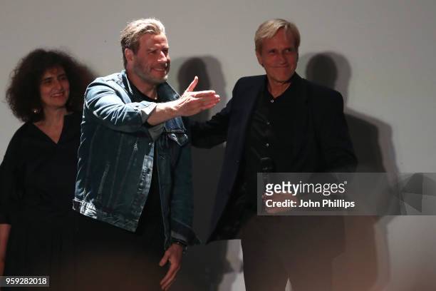 Actor John Travolta and director Randall Kleiser attend the "Grease" 40th Anniversary Screening during the 71st annual Cannes Film Festival at on May...