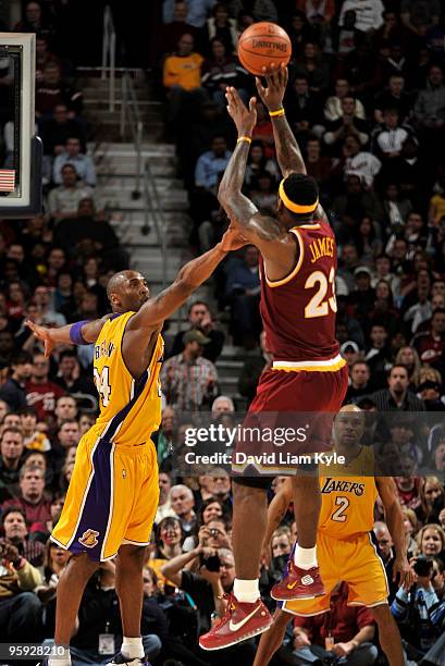 LeBron James of the Cleveland Cavaliers shoots over Kobe Bryant of the Los Angeles Lakers on January 21, 2010 at The Quicken Loans Arena in...