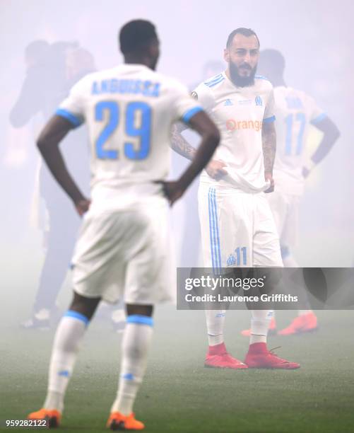 Andre-Frank Zambo Anguissa and Kostas Mitroglou of Marseille stand dejected after losing the UEFA Europa League Final between Olympique de Marseille...