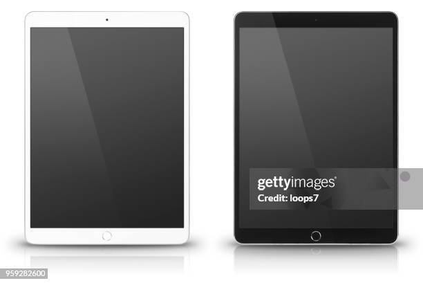ipad pro. white and black versions. - ipad pro stock pictures, royalty-free photos & images