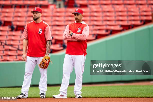 Blake Swihart and manager Alex Cora of the Boston Red Sox look on before a game against the Oakland Athletics on May 16, 2018 at Fenway Park in...