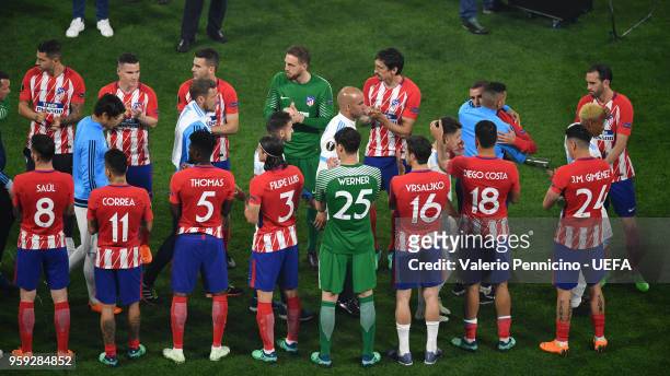 Atletico Madrid players give a guard of honour to Marseille players following the UEFA Europa League Final between Olympique de Marseille and Club...