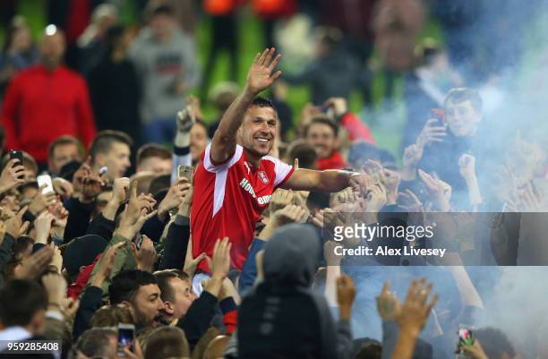 Richard Wood of Rotherham United is carried by supporters after victory in the Sky Bet League One Play Off Semi Final second leg match between...