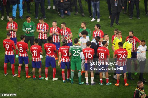 Atletico Madrid players give a guard of honour to Marseille players following the UEFA Europa League Final between Olympique de Marseille and Club...