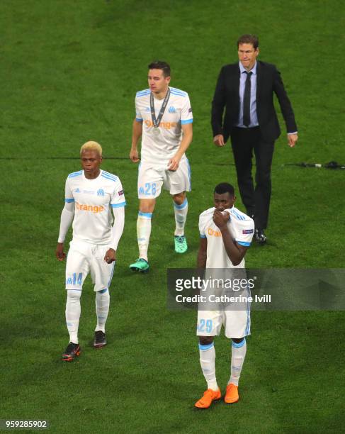 Andre-Frank Zambo Anguissa, Jordan Amavi, Florian Thauvin of Marseille and Rudi Garcia head coach of Marseille look dejected following the UEFA...