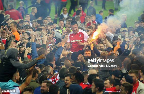 Richard Wood of Rotherham United is carried by supporters after victory in the Sky Bet League One Play Off Semi Final second leg match between...