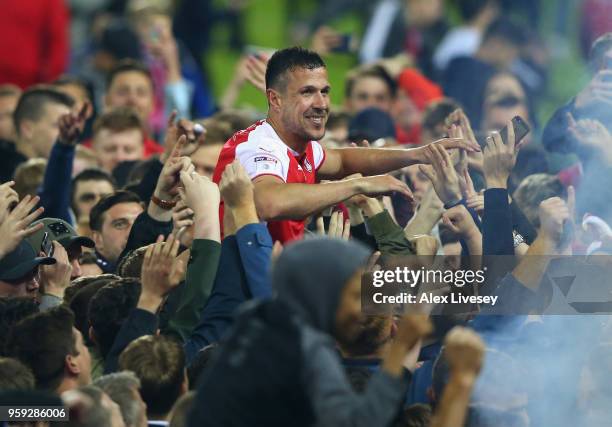 Richard Wood of Rotherham United is carried by supporters after victory in the Sky Bet League One Play Off Semi Final second leg match between...