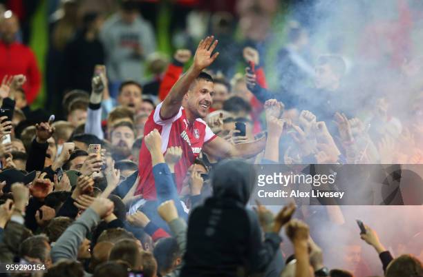 Richard Wood of Rotherham United is carried by supporters after victory in the Sky Bet League One Play Off Semi Final second leg match between...