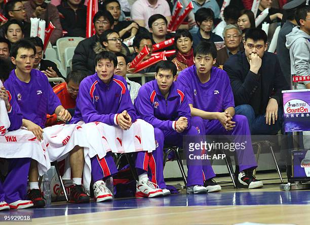In a picture taken on January 20, 2010 NBA's Houston Rockets Yao Ming , the new owner of China Basketball Association's Shanghai Sharks, sits with...