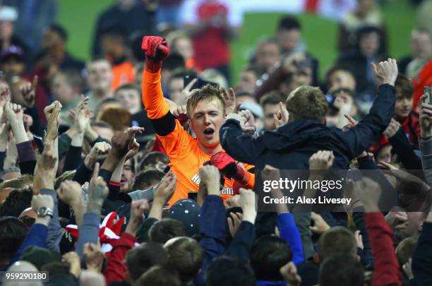 Marek Rodak of Rotherham United is carried by supporters after victory in the Sky Bet League One Play Off Semi Final second leg match between...