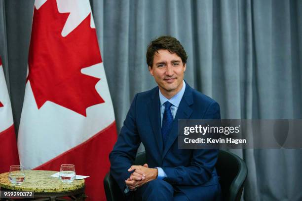 Canada's Prime Minister Justin Trudeau smiles for photos during his meeting with AppNexus President Michael Rubenstein on May 16, 2018 in New York...