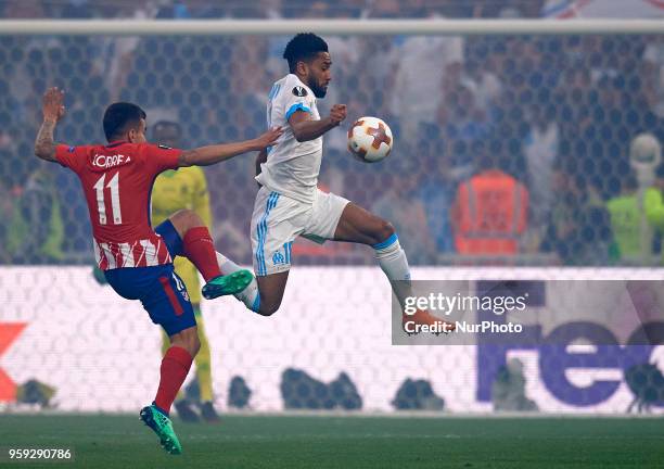 Angel Correa of Atletico de Madrid dispute the ball with Jordan Amavi of Olympique de Marseille during the match of the UEFA Europa League final...