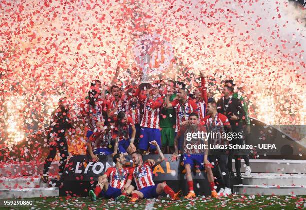 Atletico Madrid players celebrate with The Europa League trophy after the UEFA Europa League Final between Olympique de Marseille and Club Atletico...