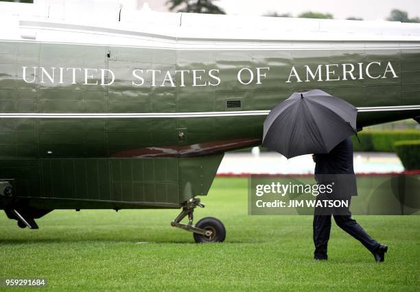 President Donald Trump crosses the South Lawn of the White House and walks to Marine One as he departs for Walter Reed National Military Medical...