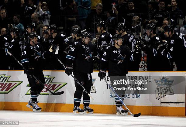 Marc-Edouard Vlasic of the San Jose Sharks is congratulated by teammates on the bench after he scored a goal against the Anaheim Ducks at HP Pavilion...