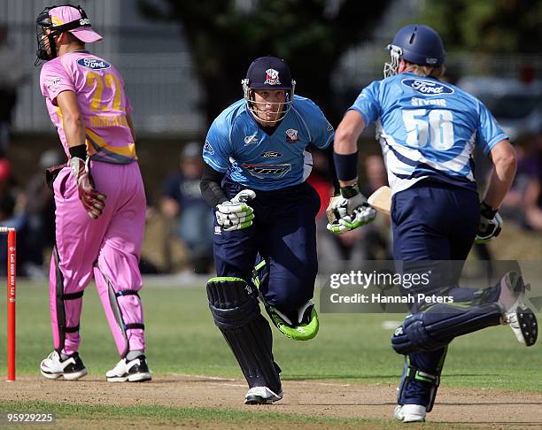 Martin Guptill and Scott Styris of Auckland run between the wickets during the HRV Cup Twenty20 match between the Auckland Aces and the Northern...