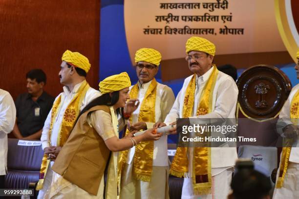 Vice President M. Venkaiah Naidu presents degrees during the 3rd convocation ceremony of Makhanlal Chaturvedi National University of Journalism and...