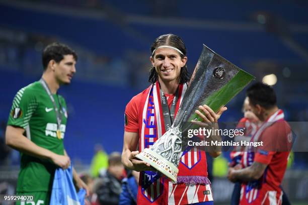 Filipe Luis of Atletico Madrid celebrates with the trophy following the UEFA Europa League Final between Olympique de Marseille and Club Atletico de...