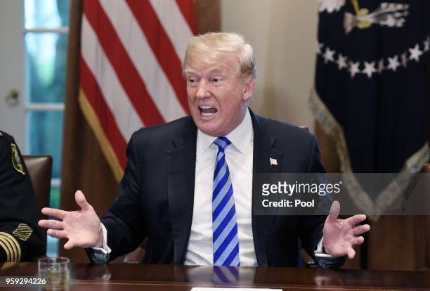 President Donald Trump speaks during a meeting with California leaders and public officials who oppose California's sanctuary policies in the Cabinet...
