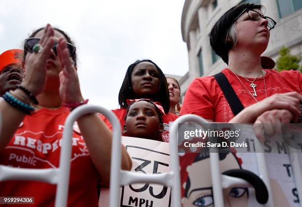 Crowds listen to speakers during the Rally for Respect outside the North Carolina Legislative Building on May 16, 2018 in Raleigh, North Carolina....