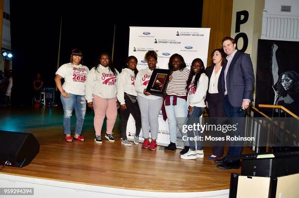 Patrick Lundquist and Michele Caplinger Sr. Executive Director of Recording Academy Atlanta Chapter present a check to at the GRAMMY Signature...