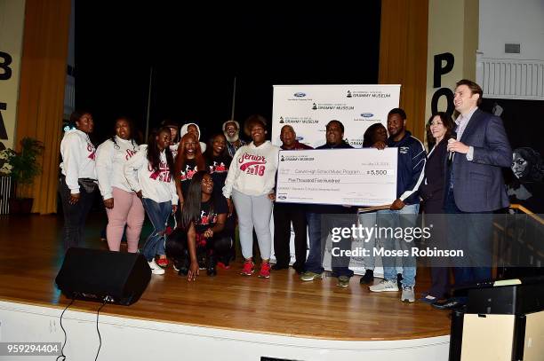 Patrick Lundquist and Michele Caplinger Sr. Executive Director of Recording Academy Atlanta Chapter present a check to at the GRAMMY Signature...