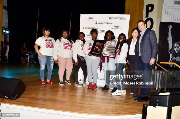 Patrick Lundquist and Michele Caplinger Sr. Executive Director of Recording Academy Atlanta Chapter present a check to at the GRAMMY Signature...