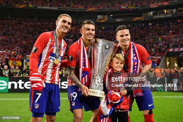 Antoine Griezmann, Lucas Hernandez and Kevin Gameiro of Atletico Madrid celebrate victory with the Europa League trophy after the UEFA Europa League...
