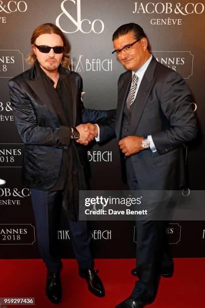 Michael Pitt and Jacob Arabo attend the Jacob & Co Cannes 2018 party at Nikki Beach on May 16, 2018 in Cannes, France.