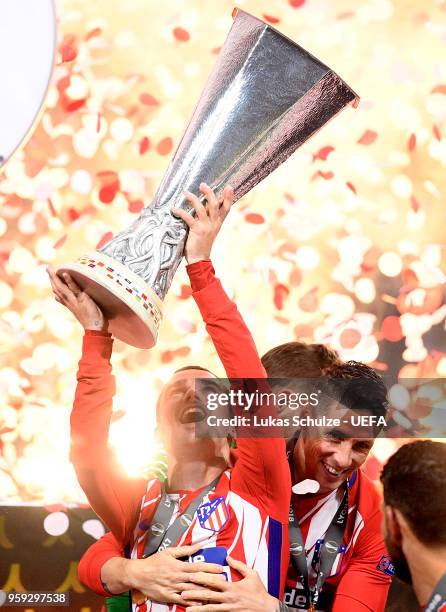 Antoine Griezmann of Atletico Madrid celebrates with the trophy following the UEFA Europa League Final between Olympique de Marseille and Club...