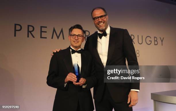 Neil Loft of Getty Images receives the photographer of the year award on behalf of Harry Trump from Martin Bayfield during the Premiership Rugby...