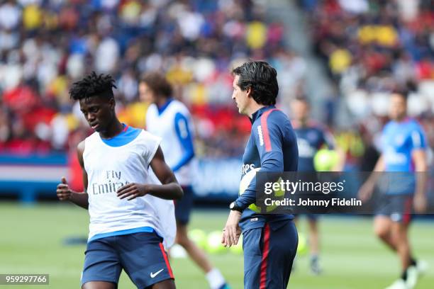 Timothy Weah and Unai Emery head coach of PSG during the training session of Paris Saint Germain at Parc des Princes on May 16, 2018 in Paris, France.