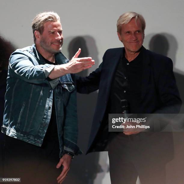 Actor John Travolta and director Randall Kleiser attend the "Grease" 40th Anniversary Screening during the 71st annual Cannes Film Festival at on May...