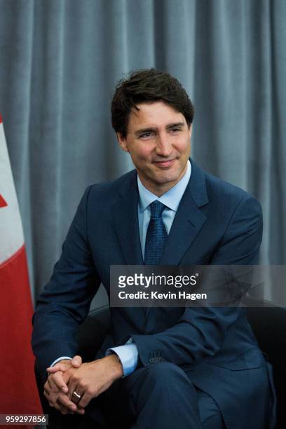 Canada's Prime Minister Justin Trudeau smiles for photos during his meeting with Pepsi CEO and Chairman Indra Nooyi on May 16, 2018 in New York City.