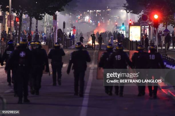 Riot police advances in the Vieux Port in Marseille on May 16 during clashes after the 2018 UEFA Europa Cup Final football match between Olympique de...