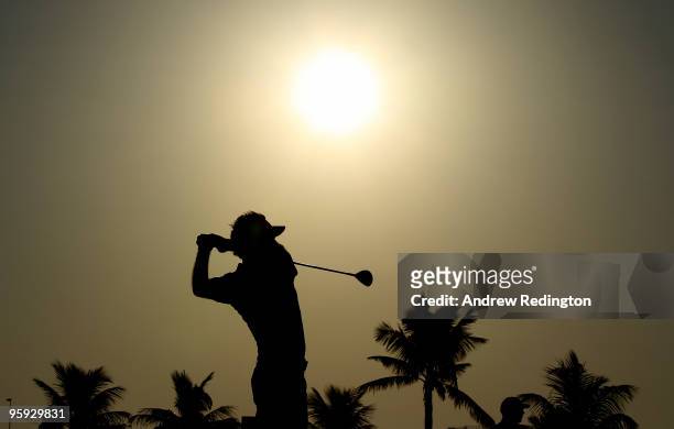Ian Poulter of England plays his second shot on the tenth hole during the second round of The Abu Dhabi Golf Championship at Abu Dhabi Golf Club on...