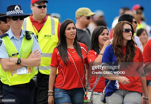 An Australian policeman keeps an eye on Chilean supporters following the men's singles three round match between Fernando Gonzalez of Chile and...