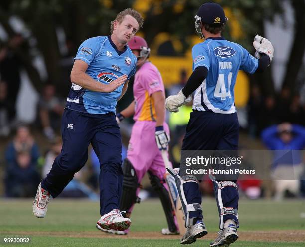 Reece Young and Scott Styris of Auckland celebrate the wicket of during the Peter McGlashan of Northern HRV Cup Twenty20 match between the Auckland...