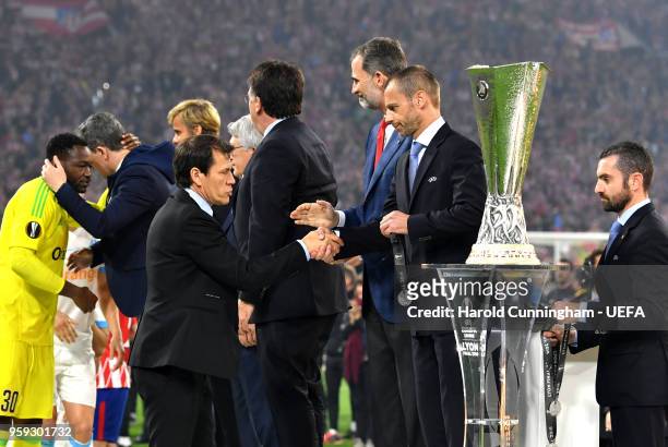 President Aleksander Ceferin and King Felipe of Spain greet Rudi Garcia head coach of Marseille after the UEFA Europa League Final between Olympique...