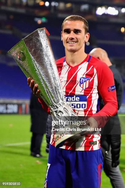 Antoine Griezmann of Club Atletico de Madrid celebrates with the trophy after winning the UEFA Europa League Final between Olympique de Marseille and...