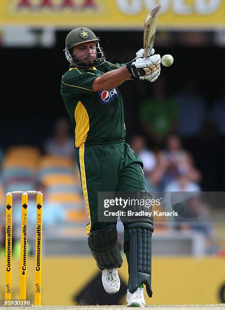 Shahid Afridi of Pakistan hits the ball to the boundary for four during the first One Day International match between Australia and Pakistan at The...