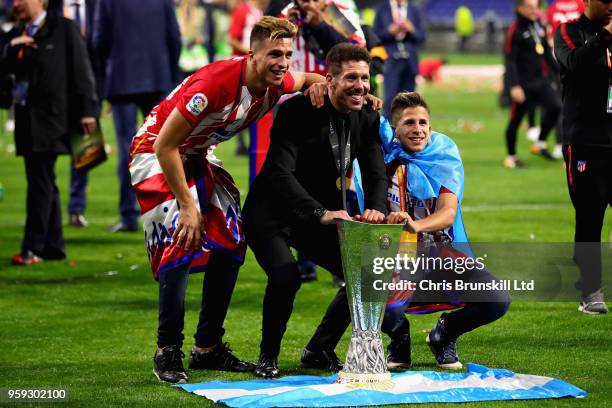 Club Atletico de Madrid manager Diego Simeone celebrates with the trophy after his side won the UEFA Europa League Final between Olympique de...