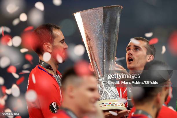 Antoine Griezmann and Diego Godin of Atletico Madrid celebrate with the trophy during the UEFA Europa League Final between Olympique de Marseille and...