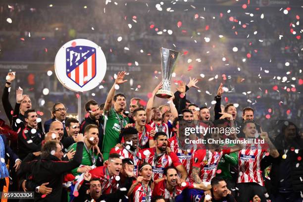 Gabi of Club Atletico de Madrid and his team lift the trophy after winning during the UEFA Europa League Final between Olympique de Marseille and...