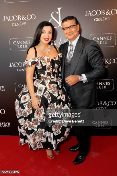 Sabina Hajieva and Jacob Arabo attend the Jacob & Co Cannes 2018 party at Nikki Beach on May 16, 2018 in Cannes, France.