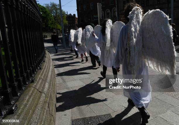 Activists from the 'Angels for Yes' campaign near Trinity College, urging a 'yes' vote in the referendum to repeal the eighth amendment of the Irish...