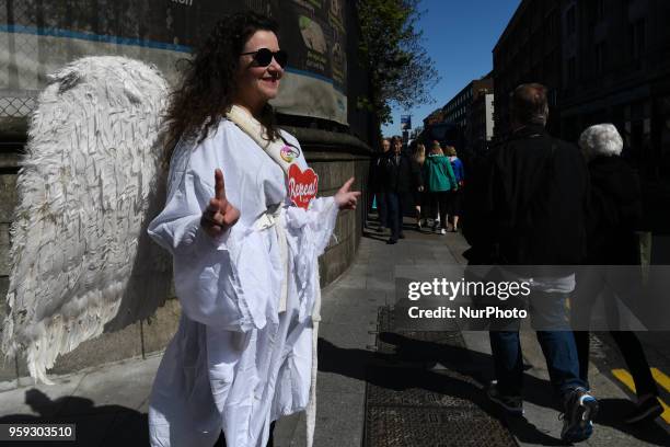 An activist from the 'Angels for Yes' campaign near Trinity College, urging a 'yes' vote in the referendum to repeal the eighth amendment of the...