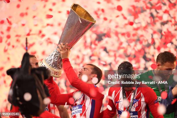 Antoine Griezmann of Atletico Madrid lifts the trophy at the end of the UEFA Europa League Final between Olympique de Marseille and Club Atletico de...