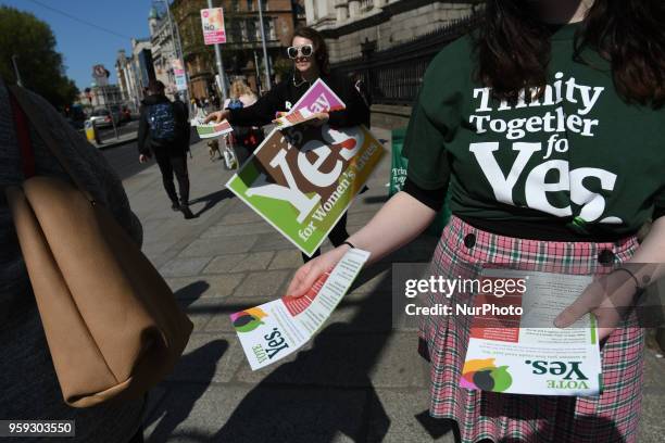 Activists from the 'Trinity Together for Yes' campaign canvass in front of the main entrance to Trinity College, urging a 'yes' vote in the...