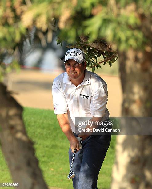 David Howell of England play his second shot from under some trees at the par 4, 6th hole during the second round of The Abu Dhabi Golf Championship...